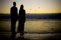 A couple on the beach on their Fiji island honeymoon