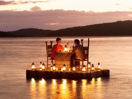 Pontoon dining for a Fiji honeymoon couple at Turtle Island Resort Fiji Islands